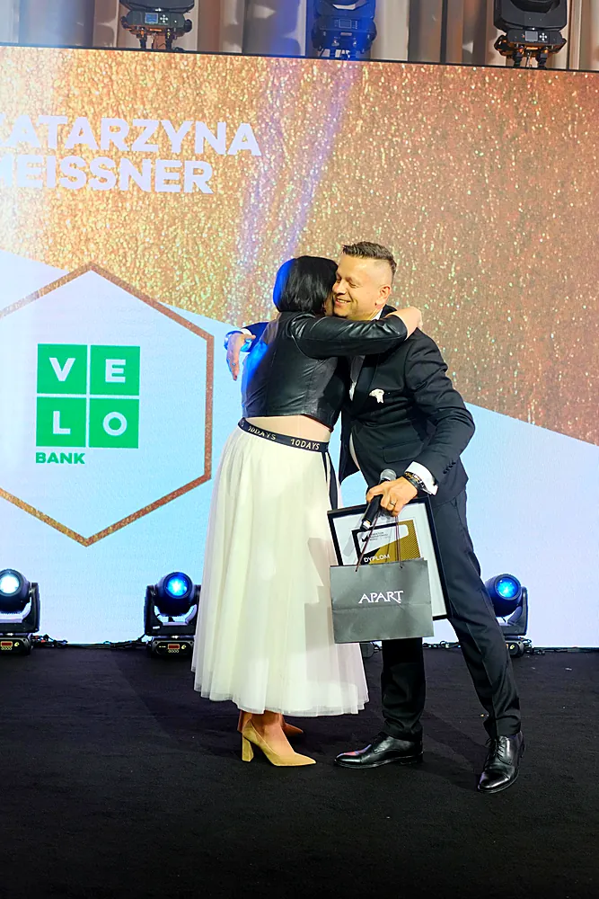 Grand Prix winners embrace on the Gala stage