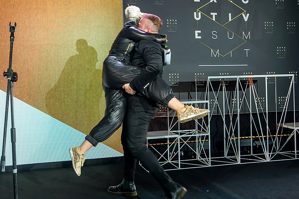 Joy on stage — a leap into a hug